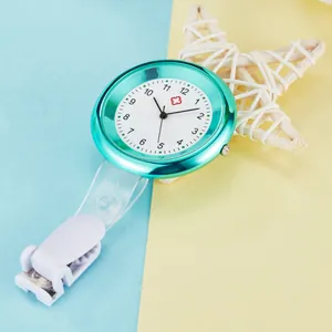 Turquoise quartz nurse fob watch with white clip-on attachment for medical professionals