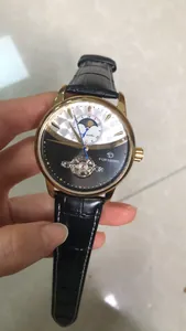 Close-up of Forsining automatic mechanical watch with moon phase and leather strap.