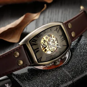 Vintage bronze tonneau mechanical watch with brown riveted leather strap