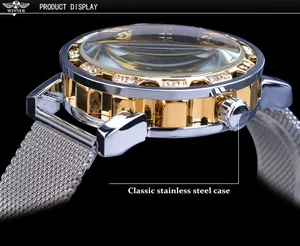 Detailed macro side view of a Winner mechanical watch with gold and silver case.