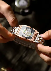 Close-up of luxury tonneau-shaped skeleton mechanical watch with rose gold strap