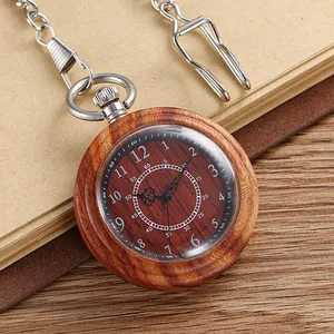 Detailed macro view of a vintage wooden pocket watch with silver chain.