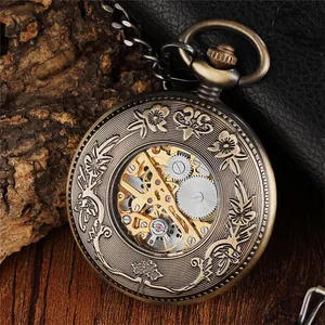 Detailed close-up of vintage bronze mechanical pocket watch with hollow floral design