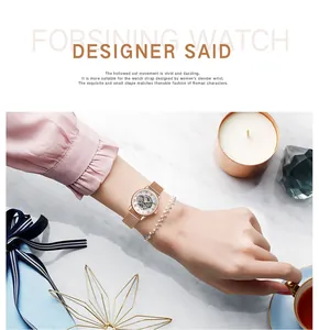 Close-up of Forsining women's skeleton mechanical watch on wrist with elegant accessories