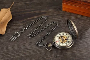 Detailed macro view of vintage bronze skeleton mechanical pocket watch with Roman dial
