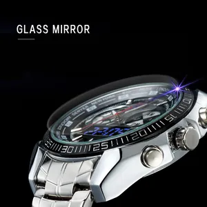 Close-up detail of silver sports watch showing dual-display dial and glass mirror