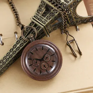 Detailed view of vintage wooden pocket watch dial with bronze chain texture