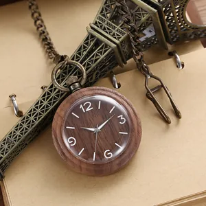 Close-up of vintage style wooden quartz pocket watch with long bronze metal chain
