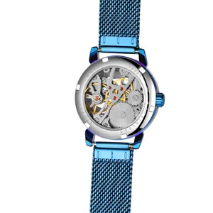 Detailed view of the mechanical movement and blue mesh strap of a women's watch.