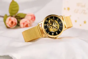 Detailed view of Forsining women's skeleton mechanical watch with gold mesh band strap.
