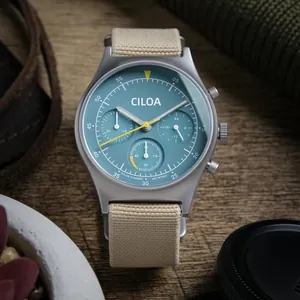 Detailed close-up of CILOA men's solar-powered sports watch with teal chronograph dial