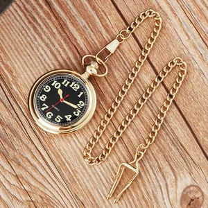 Élégante montre à gousset à quartz dorée avec aiguilles lumineuses sur fond de bois