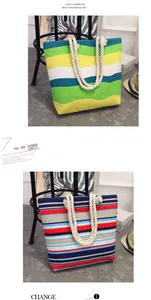 Detail view of striped canvas tote bags with thick white rope handles.