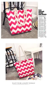 Detailed view of large red chevron canvas tote bag with rustic rope handles