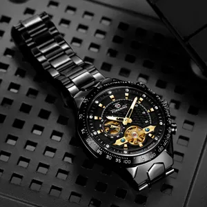Close-up of Forsining black automatic mechanical watch with gold accents and skeleton dial.