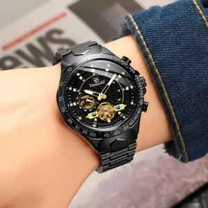 Detail of Forsining men's black mechanical watch with skeleton dial on wrist.