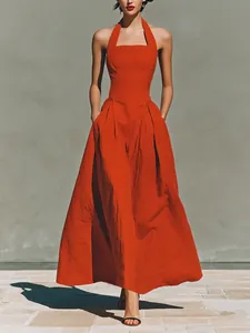 Elegant red halter neck maxi dress featuring linen-like texture and functional pockets