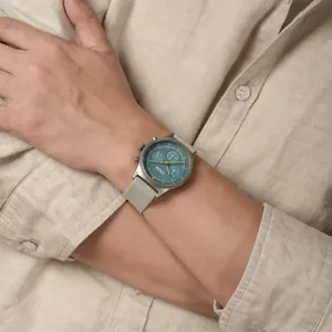 Detailed view of CILOA men's chronograph watch featuring teal dial and silver metal mesh strap