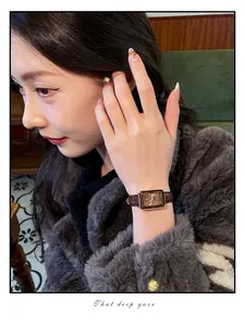 CILOA luxury rectangular watch with brown leather strap displayed on model's wrist
