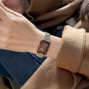 Elegant CILOA luxury women's rectangular watch featuring a brown dial and bicolor link bracelet