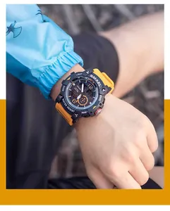 Detailed macro view of a SMAEL men's rugged outdoor dual display watch worn on a wrist