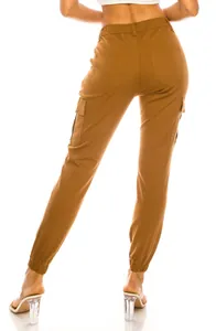 Rear view of women's brown outdoor cargo pants featuring elastic waist and utility pockets