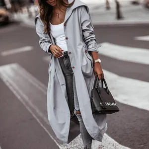 Detailed view of a grey mid-length trench coat with an oversized collar design.