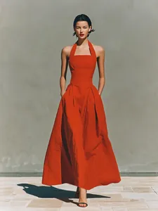 Elegant red halter neck maxi dress with side pockets in breathable linen-like fabric