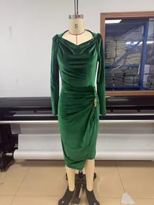 Detailed view of green velvet long sleeve dress with cowl neck and ruched side detail