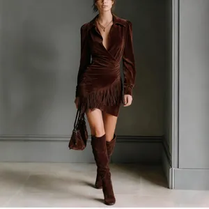 Full-length detail of brown suede fringe dress showcasing Western style and long sleeves