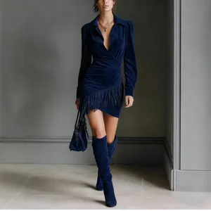Detailed view of navy blue suede wrap dress with stylish fringe hemline