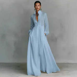 Elegant light blue pleated maxi dress featuring long sleeves and a flared hemline
