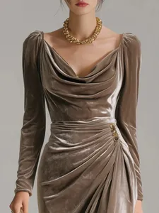 Detailed view of the elegant velvet dress with draped cowl neck and ruched waist