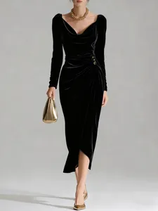 Elegant black velvet long sleeve ruched midi dress with side slit and gold details