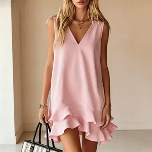 Close-up of sleeveless pink V-neck dress with elegant tiered ruffle hem detail