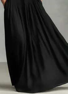 Close-up detail of flowing black fabric on an elegant French style long maxi dress