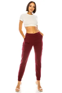 Detailed view of burgundy women's cargo pants with multi-pockets and an elastic waist band.