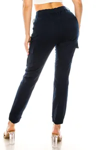 Rear view of women's navy blue cargo pants featuring elastic waist and utility pockets