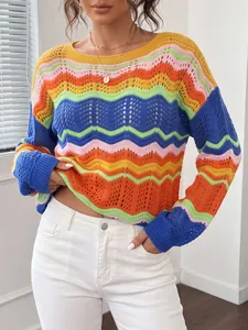 Close-up of the colorful rainbow chevron knit pattern and hollow stitch detail on a pullover sweater.