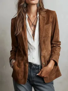 Detail shot showing the texture of an elegant brown suede women's jacket with buttons