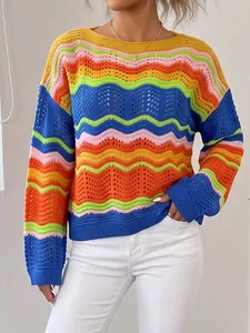Detailed view of women's rainbow crochet knit sweater showing vibrant colorful stripes