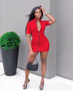 Detailed view of a red mini bodycon dress with front zipper worn by a fashion model