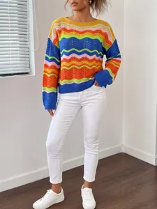 Detailed view of a model wearing a vibrant rainbow striped open-knit sweater with long sleeves