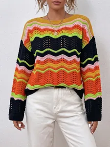 Close-up of a vibrant rainbow striped crochet sweater featuring delicate hollow-out knit details
