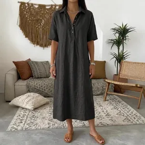 Casual charcoal linen short sleeve polo midi dress for women in a stylish boho setting