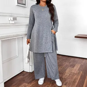Close-up detail of casual gray long-sleeve tunic top with matching wide-leg trousers