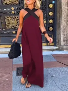 Elegant criss-cross halter maxi dress with backless design in burgundy and black tones