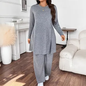 Detail of elegant grey long-sleeve tunic and wide-leg trousers fashion lounge set
