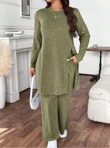 Lifestyle view of olive green casual two-piece set worn by model in a stylish interior