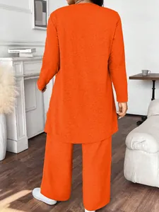 Back view of a vibrant orange two-piece casual long sleeve top and pants set